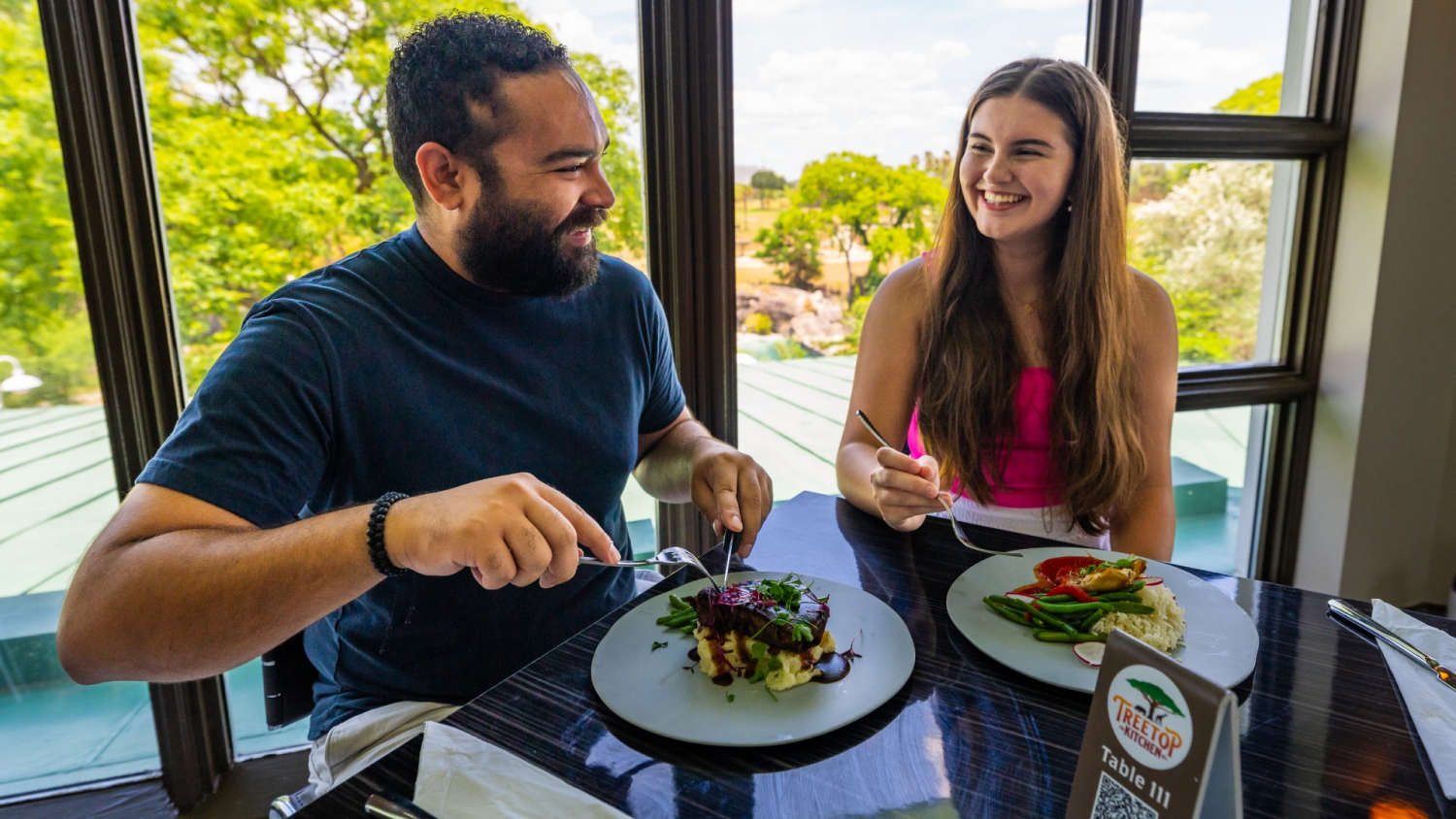 Couple eating a meal at Treetop Kitchen at Busch Gardens Tampa Bay