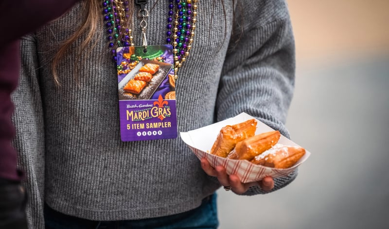 Mardi gras sampler lanyard and beignets