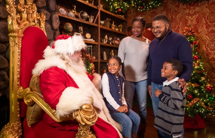Santa on a chair with a family