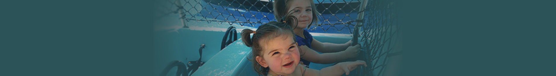 Two children on a small boat ride