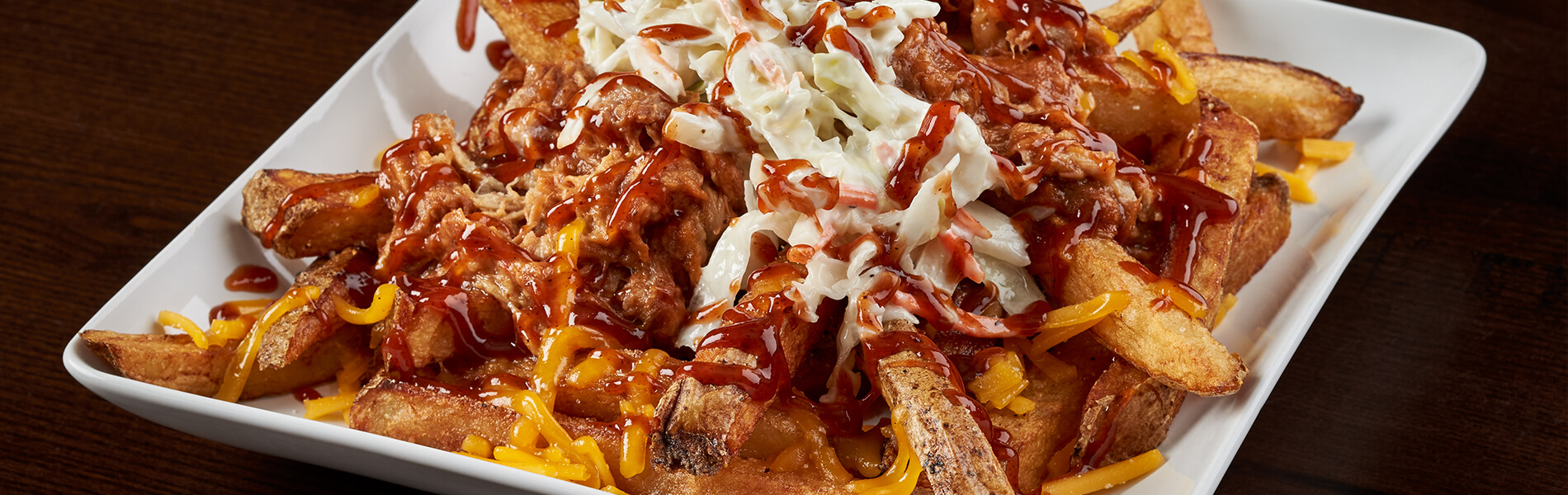 Enjoy a loaded batch of fries with a refreshing Coca-Cola® beverage or a beer on tap.